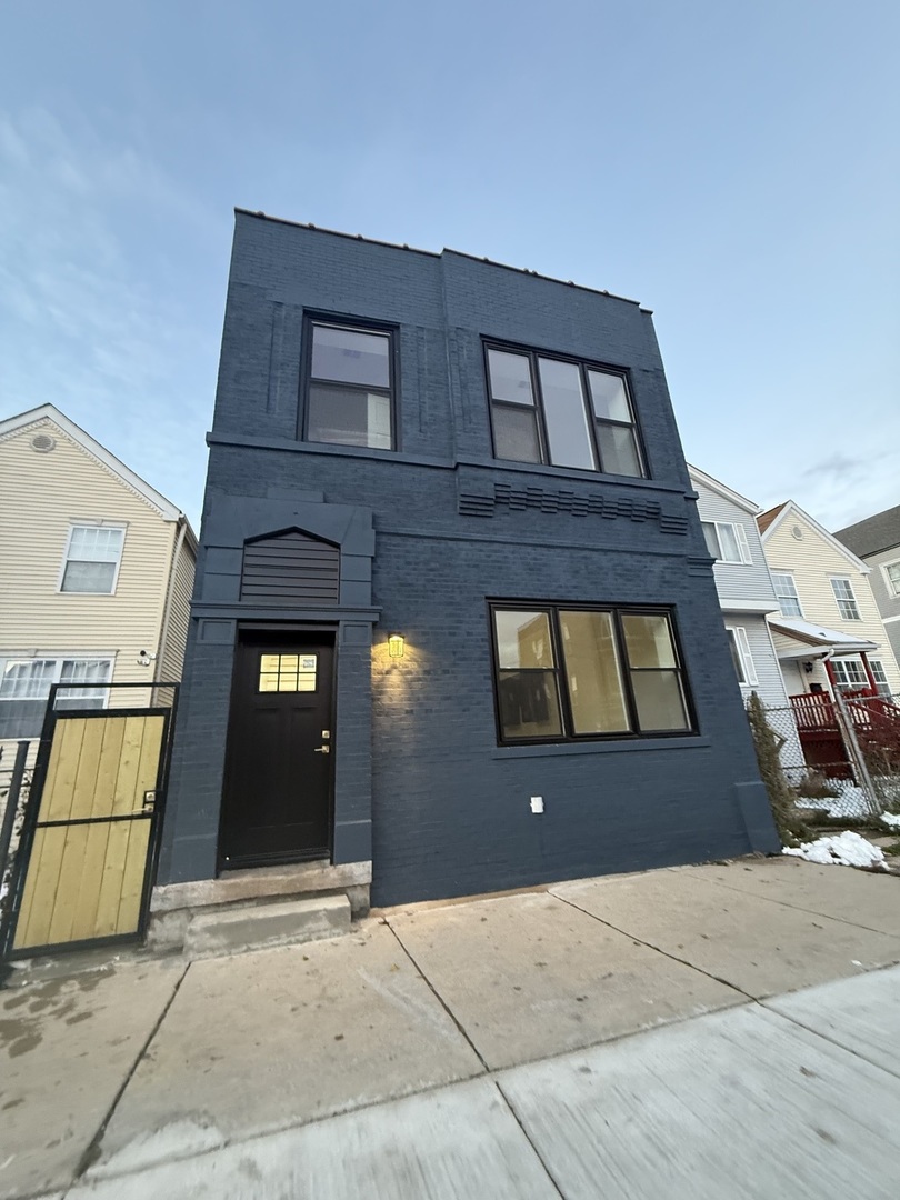 a front view of a house with a garage