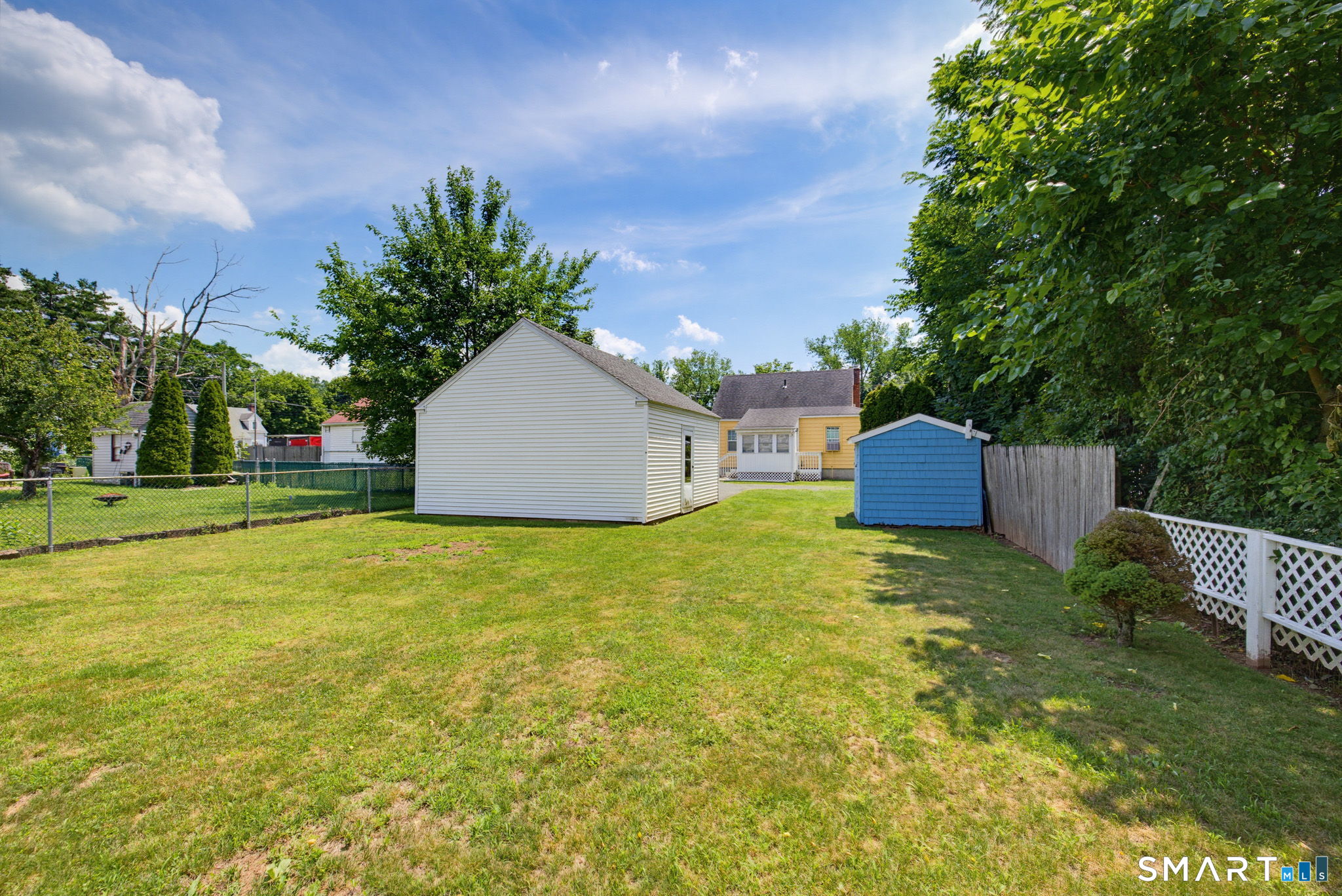 417 Hartford Road Manchester, CT 06040 - Photo 35 of 38 Look at this large, level back yard that is perfect for yard games and gardens!