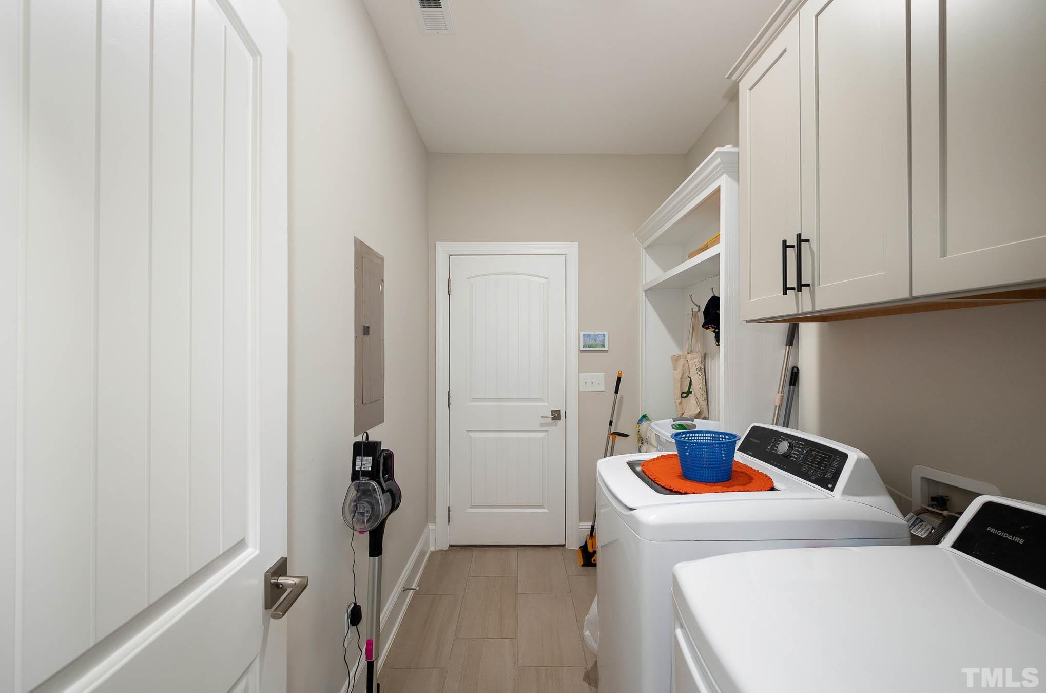 8801 Rainer Way Wake Forest, NC 27587 - Photo 12 of 34 a room with storage and utility