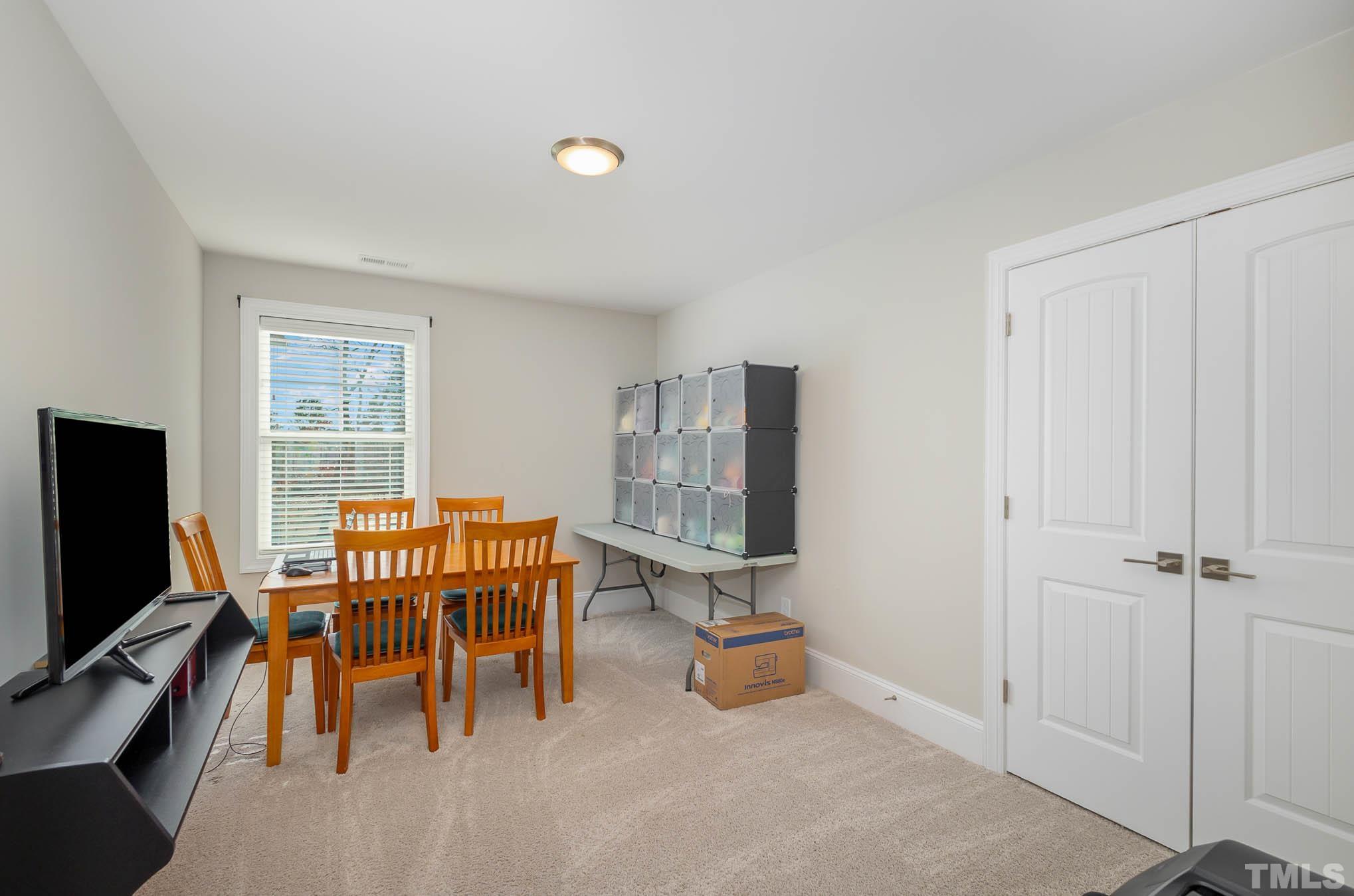 8801 Rainer Way Wake Forest, NC 27587 - Photo 18 of 34 a view of a livingroom with furniture and windows