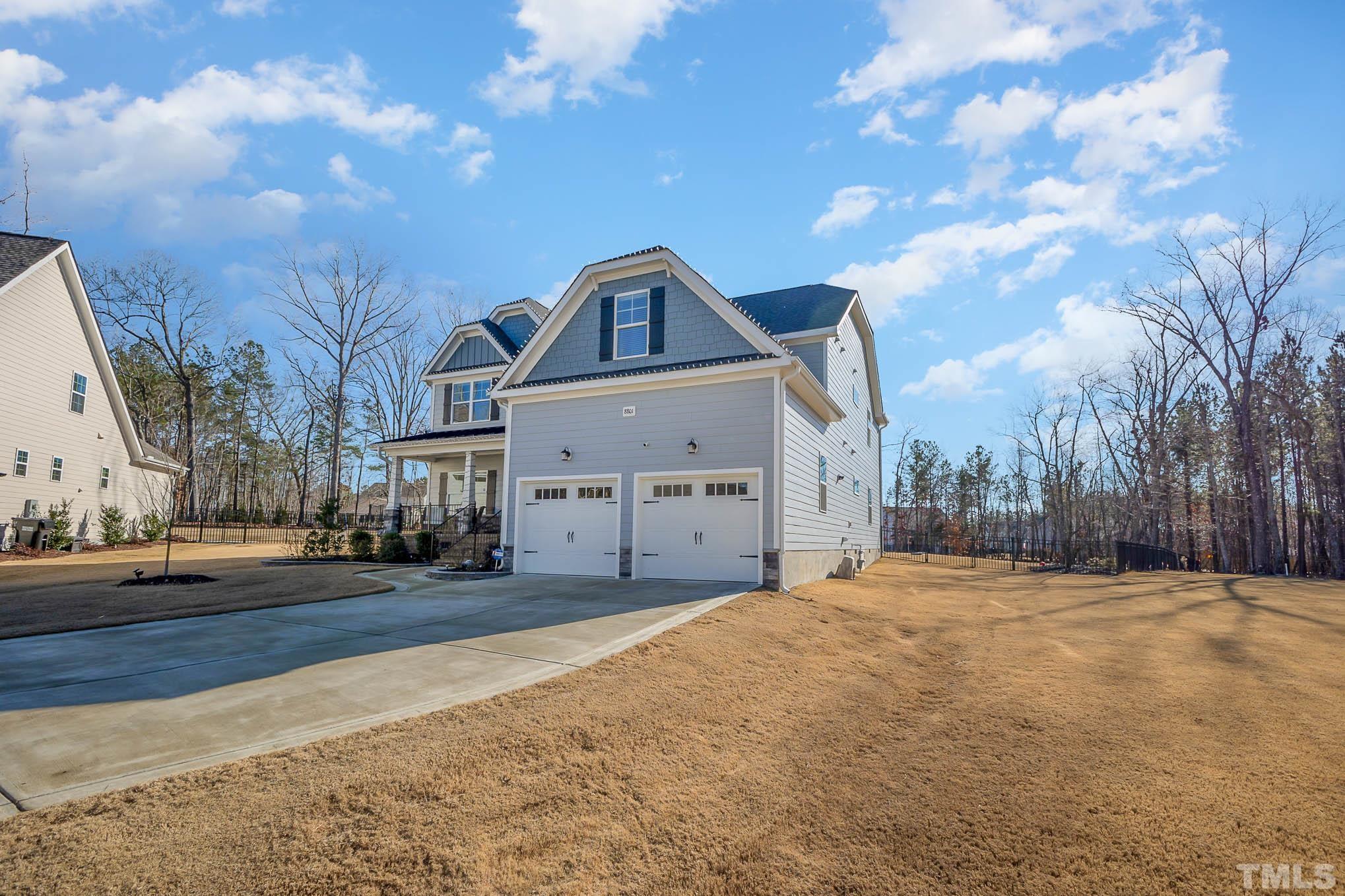 8801 Rainer Way Wake Forest, NC 27587 - Photo 2 of 34 a front view of a house with a yard