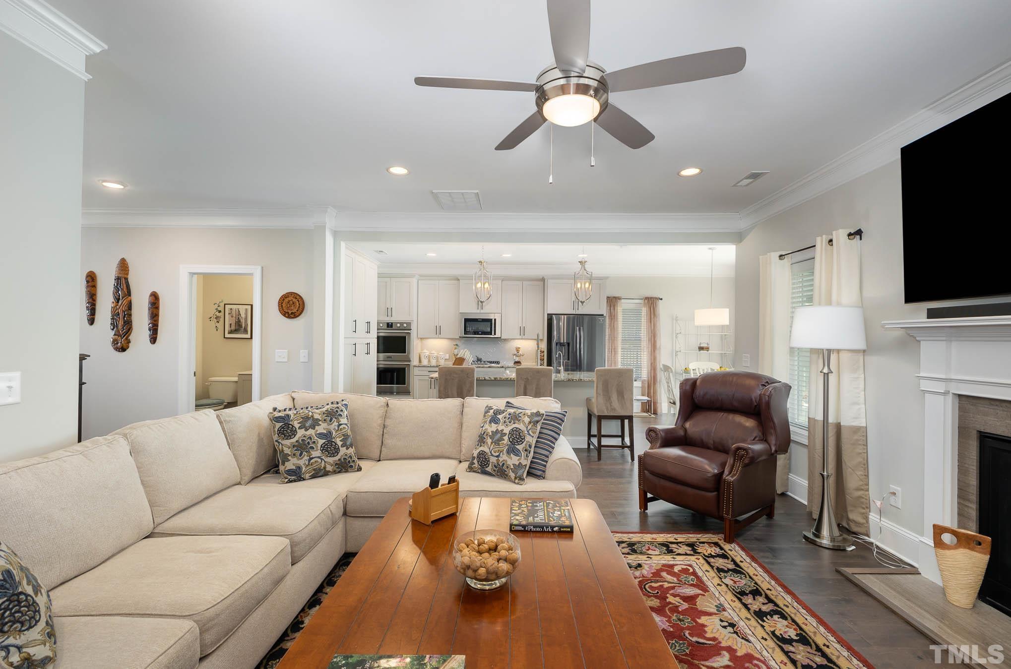 8801 Rainer Way Wake Forest, NC 27587 - Photo 7 of 34 a living room with furniture fireplace and a flat screen tv
