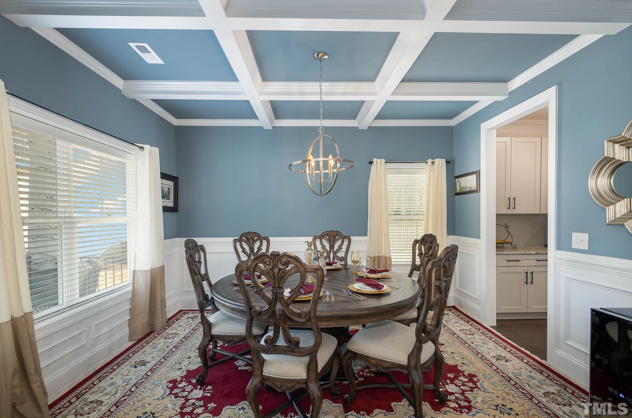 8801 Rainer Way Wake Forest, NC 27587 - Photo 8 of 34 a view of a dining room with furniture and wooden floor