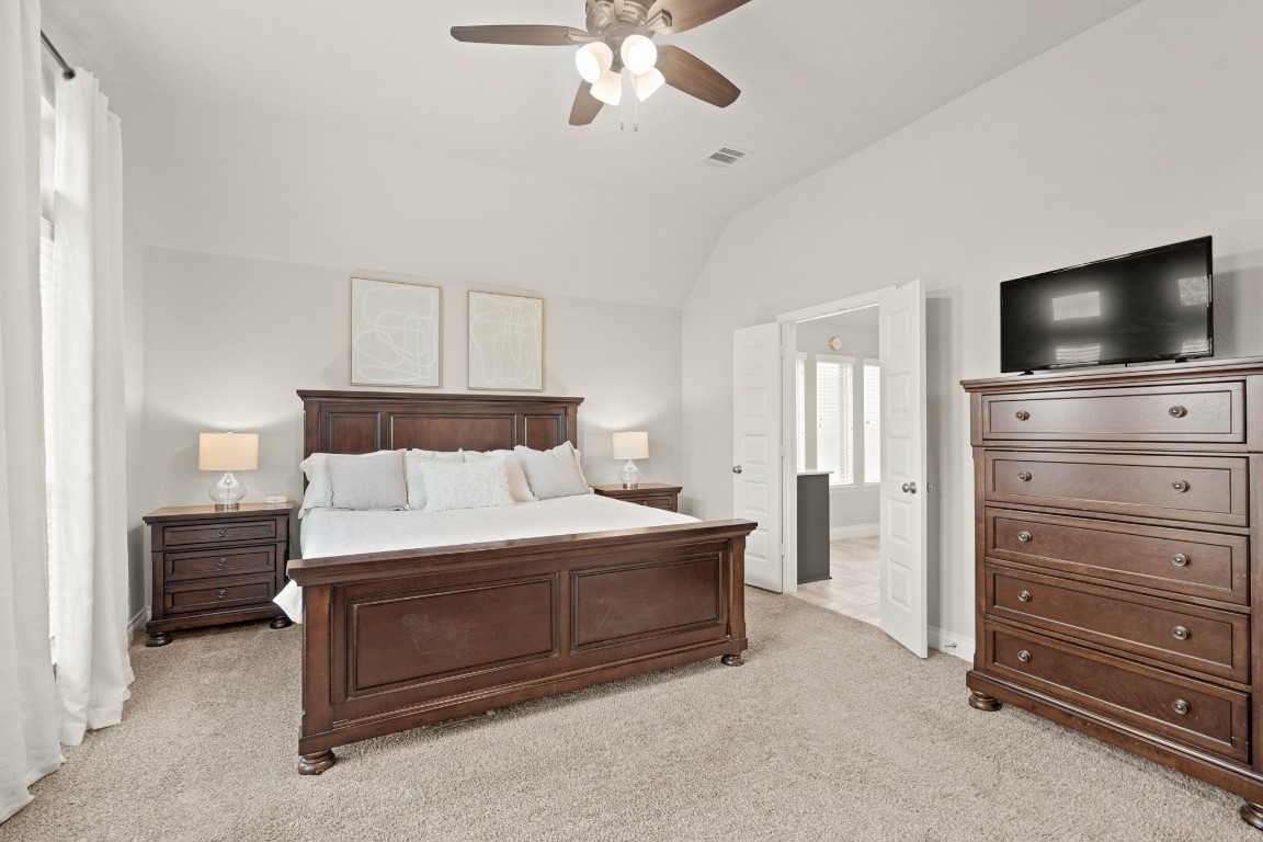6918 Goldstrum Way Katy, TX 77493 - Photo 13 of 27 a bedroom with a bed and a television