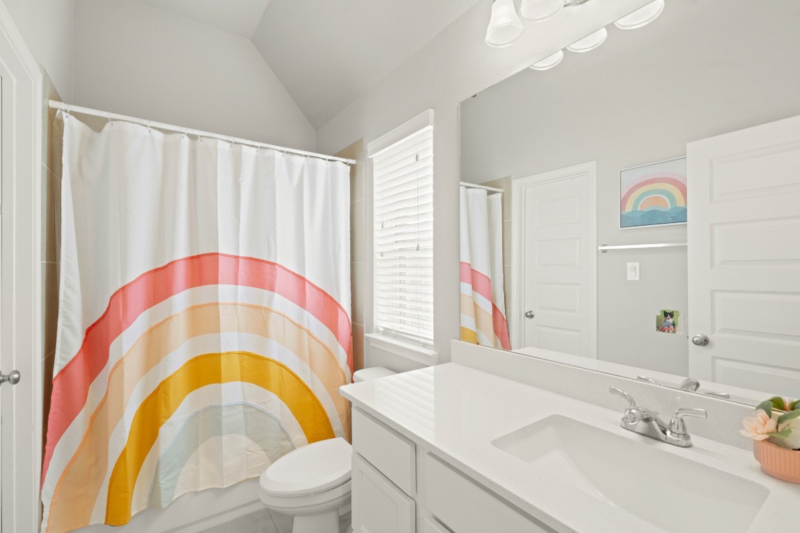 6918 Goldstrum Way Katy, TX 77493 - Photo 17 of 27 a bathroom with a sink and a mirror