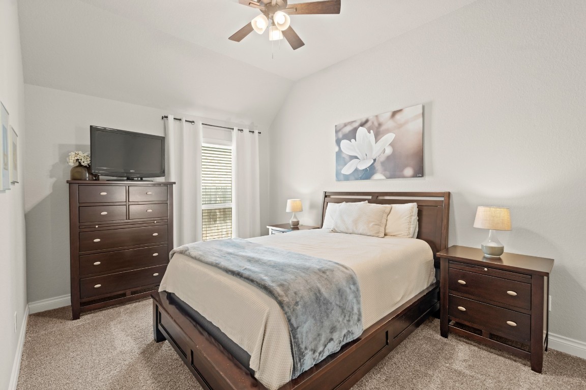 6918 Goldstrum Way Katy, TX 77493 - Photo 18 of 27 a bedroom with a bed and a television