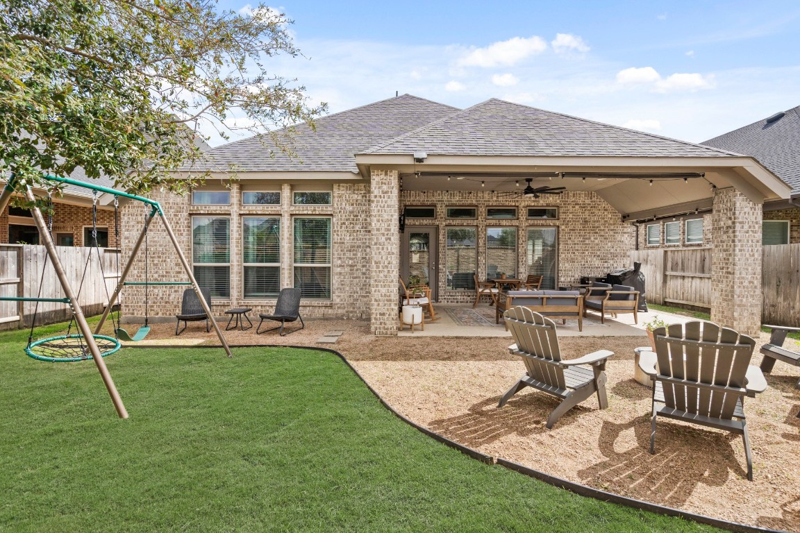 6918 Goldstrum Way Katy, TX 77493 - Photo 23 of 27 a view of a house with backyard porch and sitting area