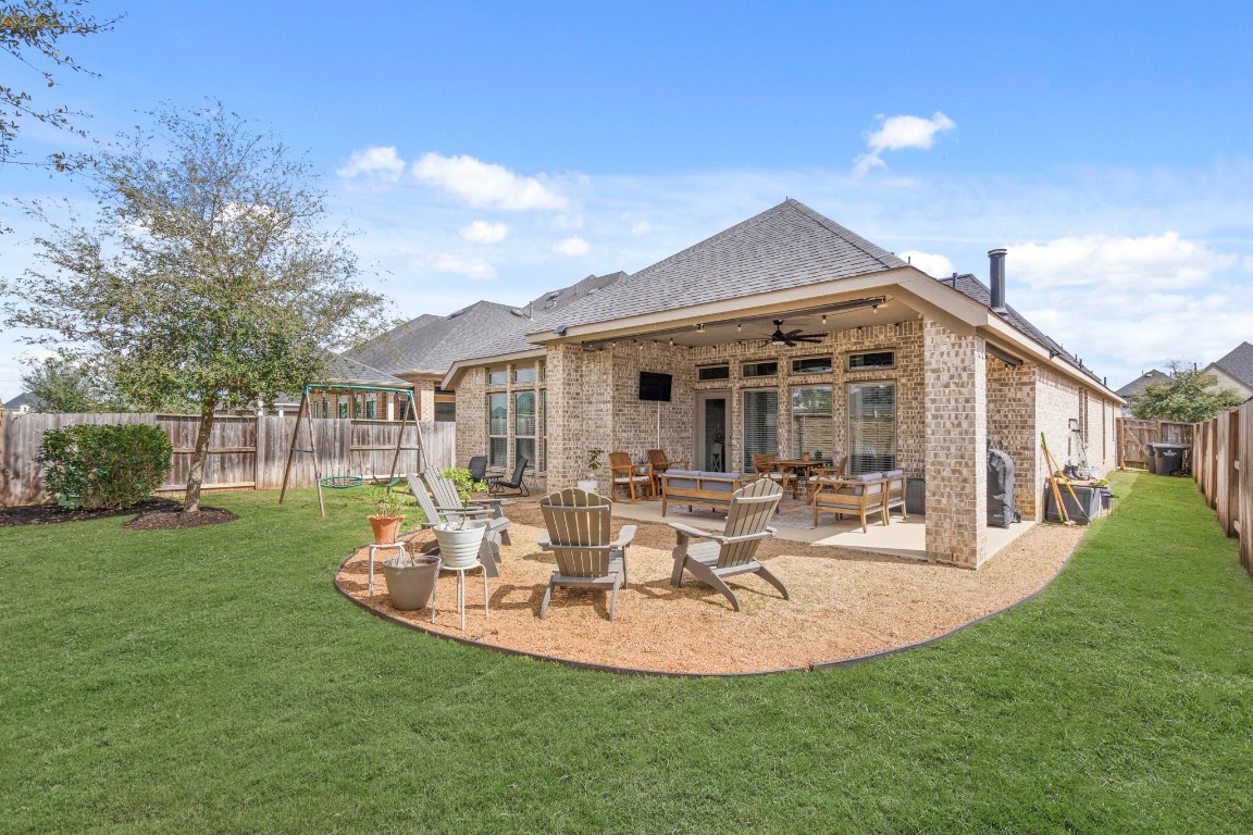 6918 Goldstrum Way Katy, TX 77493 - Photo 24 of 27 a view of a house with backyard porch and sitting area