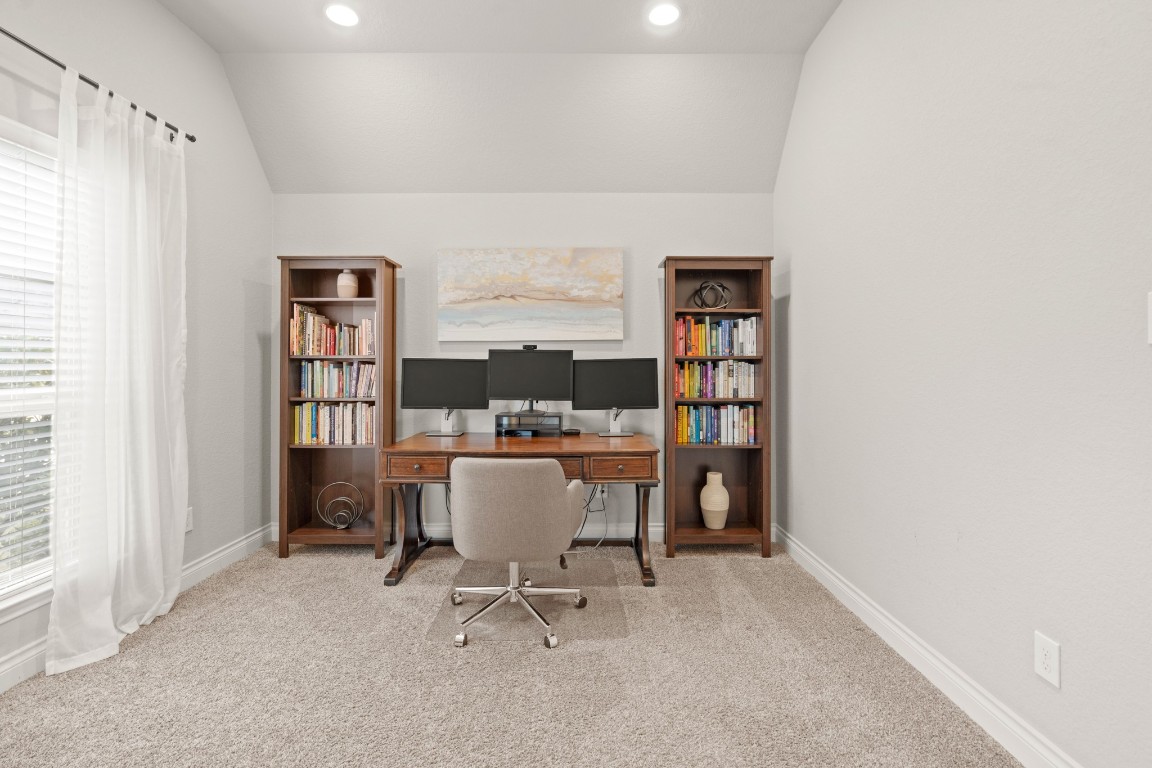 6918 Goldstrum Way Katy, TX 77493 - Photo 3 of 27 a view of a workspace with furniture and a window