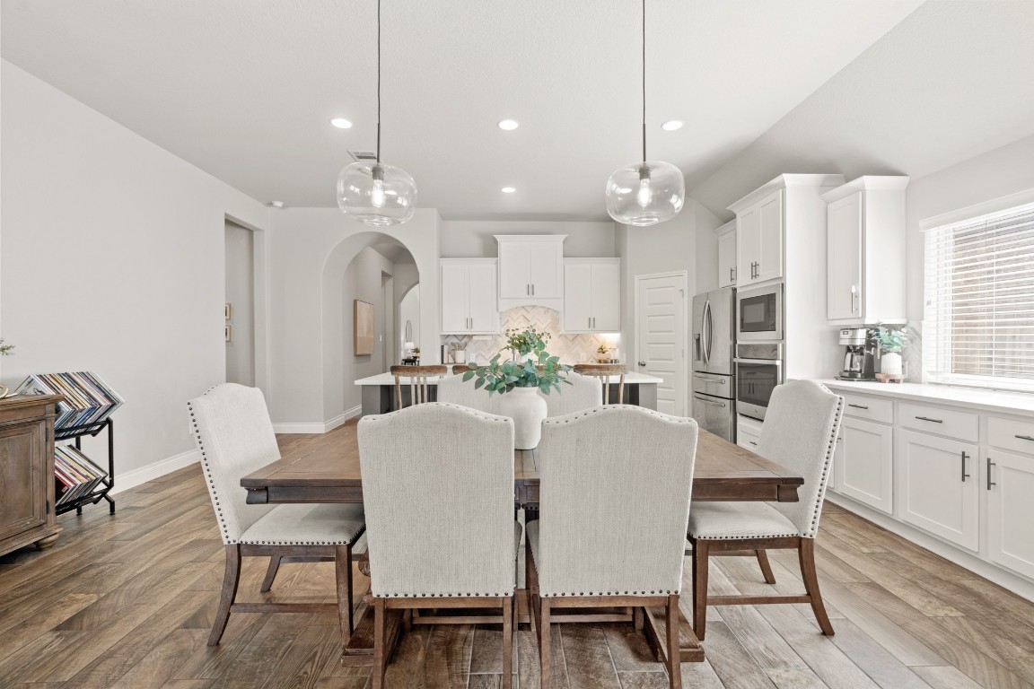 6918 Goldstrum Way Katy, TX 77493 - Photo 26 of 27 a view of a dining room with furniture window and wooden floor