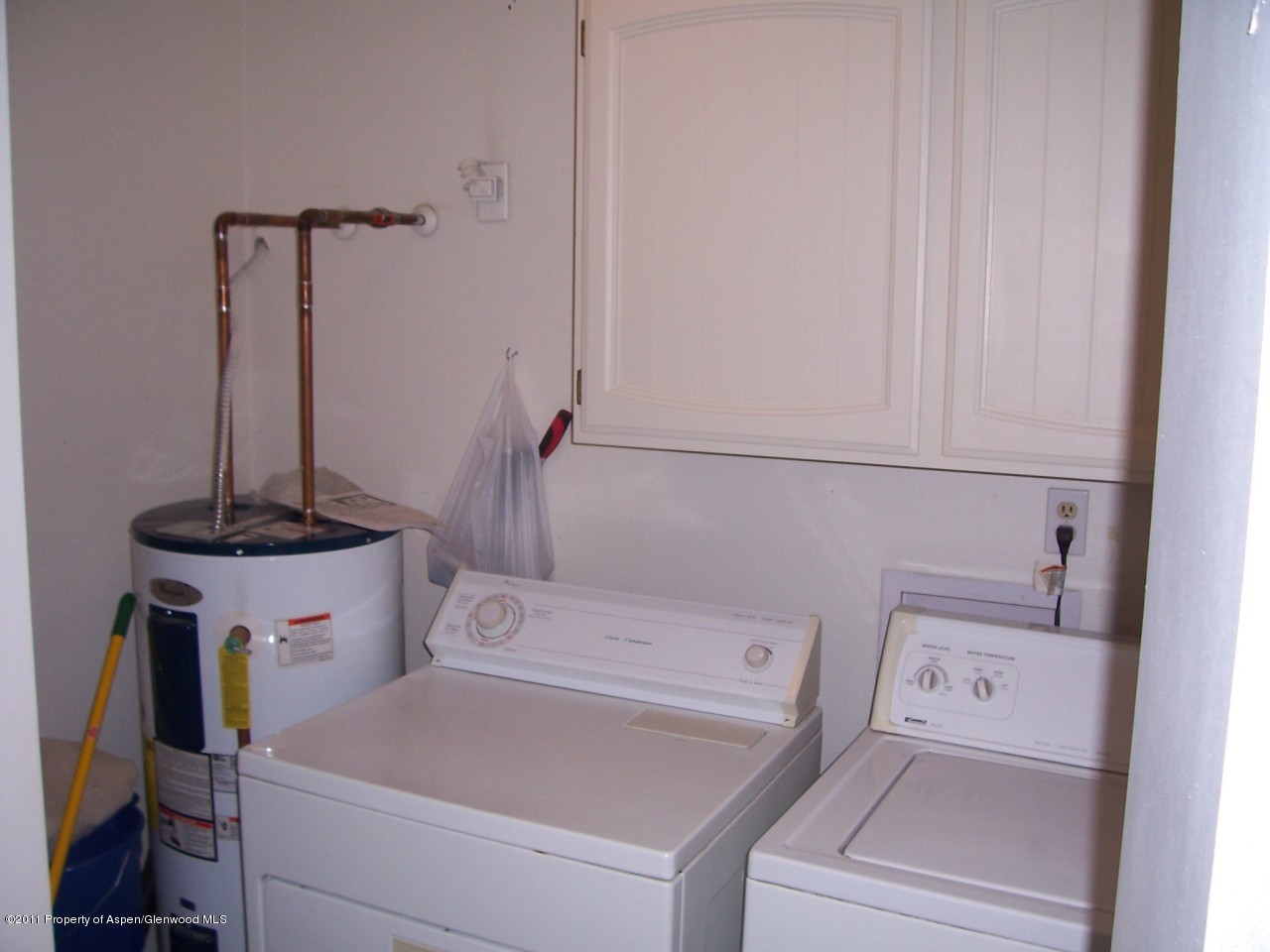 369 South 9th Street Rifle, CO 81650 - Photo 4 of 9 a view of storage and utility room with washer and dryer