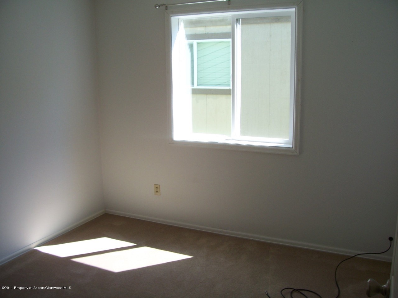 369 South 9th Street Rifle, CO 81650 - Photo 7 of 9 an empty room with a window