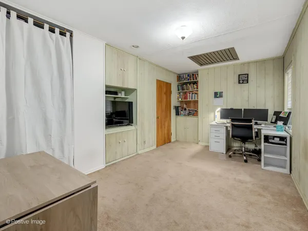 a view of workspace with furniture and window