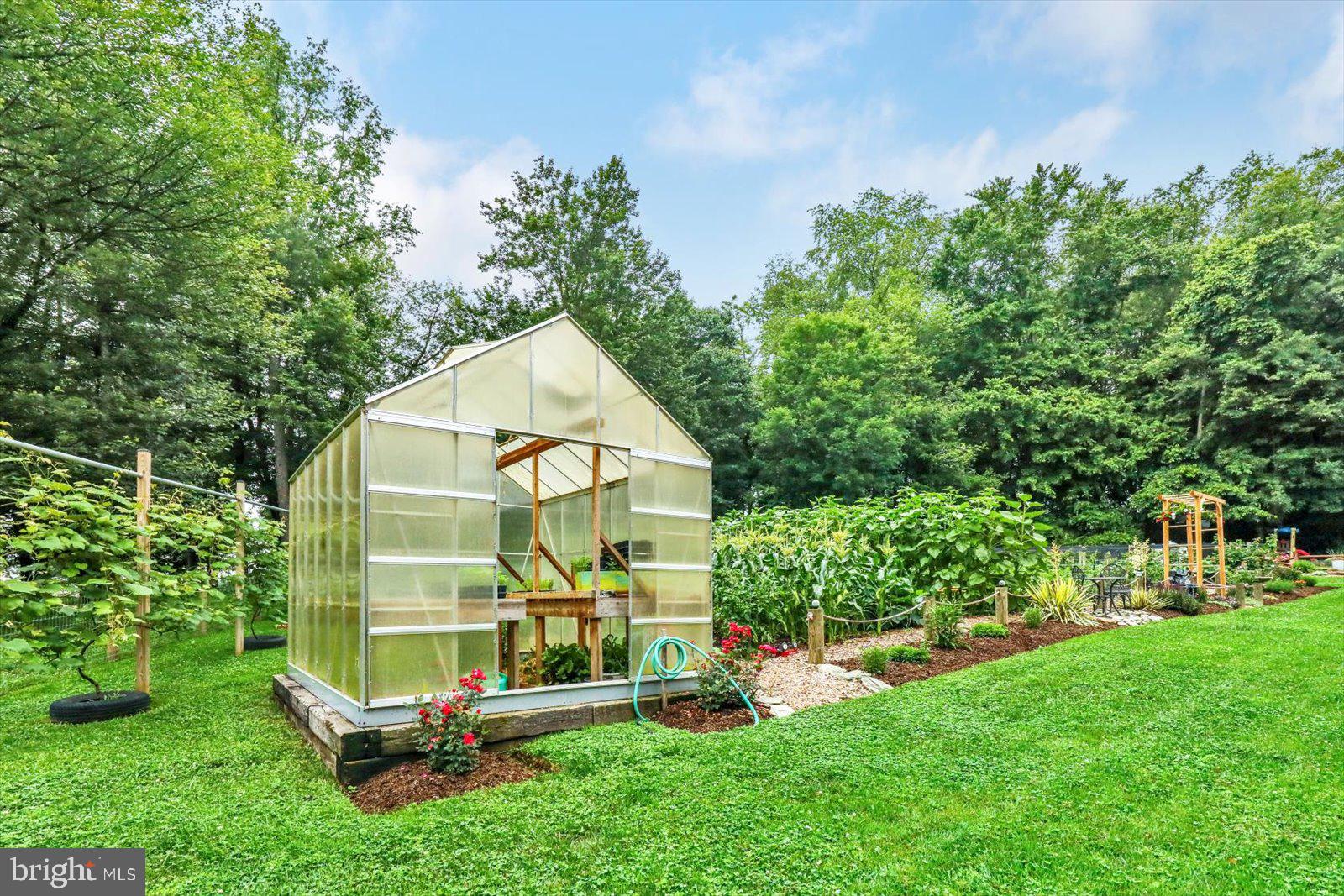1881 Georgetown Road Christiana, PA 17509 - Photo 15 of 45 a view of backyard with a garden and entertaining space
