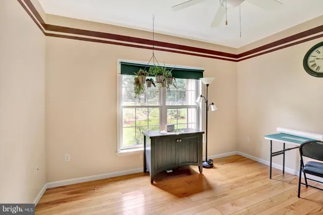 a view of a livingroom with furniture and a wooden floor