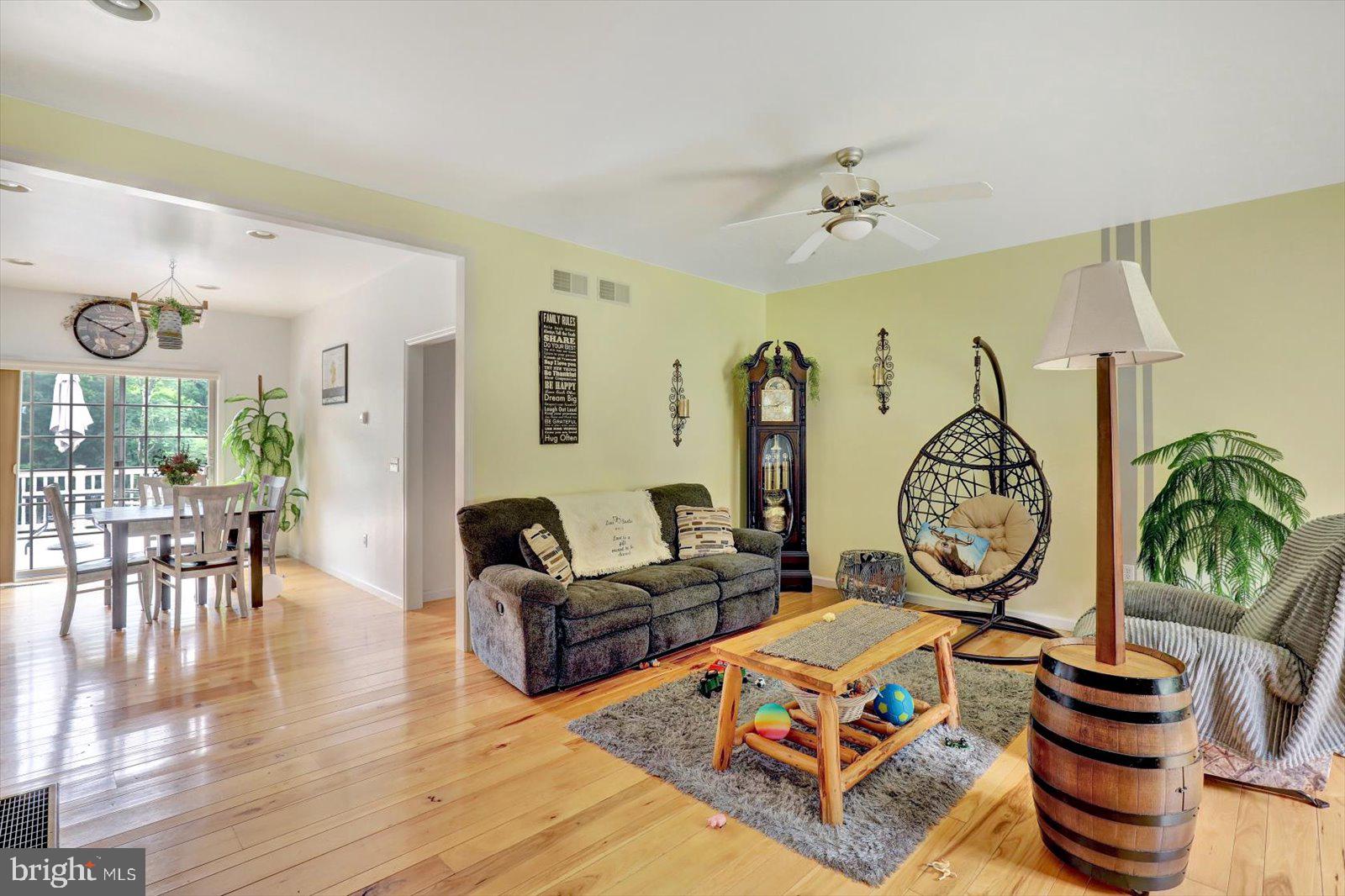 1881 Georgetown Road Christiana, PA 17509 - Photo 30 of 45 a living room with furniture a rug and a chandelier