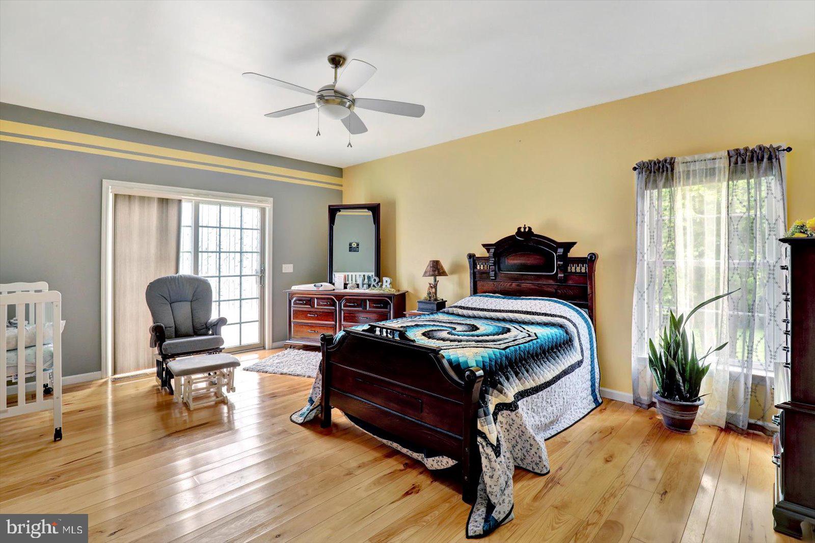 1881 Georgetown Road Christiana, PA 17509 - Photo 32 of 45 a bedroom with furniture and wooden floor