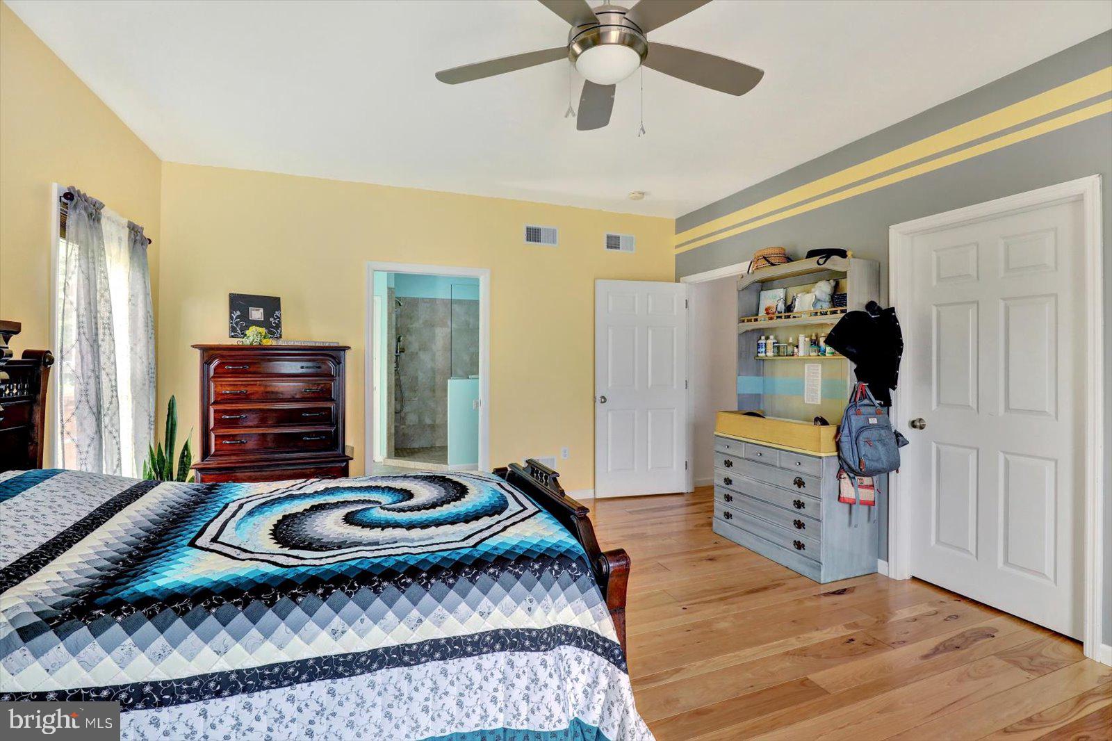 1881 Georgetown Road Christiana, PA 17509 - Photo 33 of 45 a bedroom with a bed and wooden floor