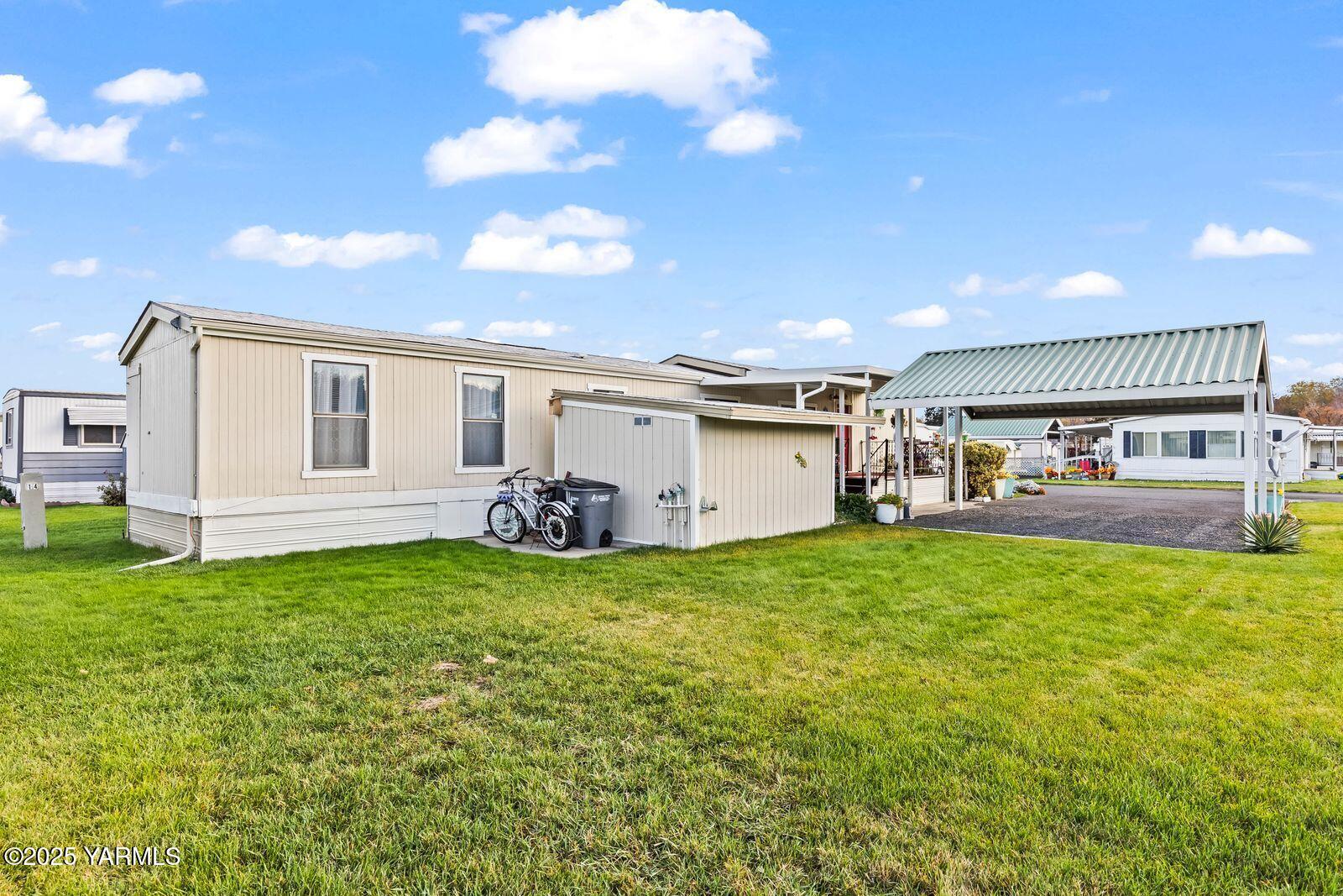 3601 Castlevale Road, Unit 14 Yakima, WA 98902 - Photo 23 of 24 a view of a house with backyard