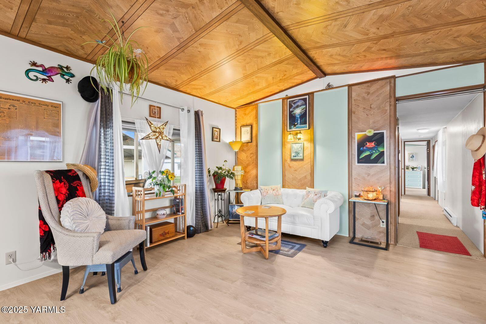 3601 Castlevale Road, Unit 14 Yakima, WA 98902 - Photo 4 of 24 a living room with furniture and a floor to ceiling window