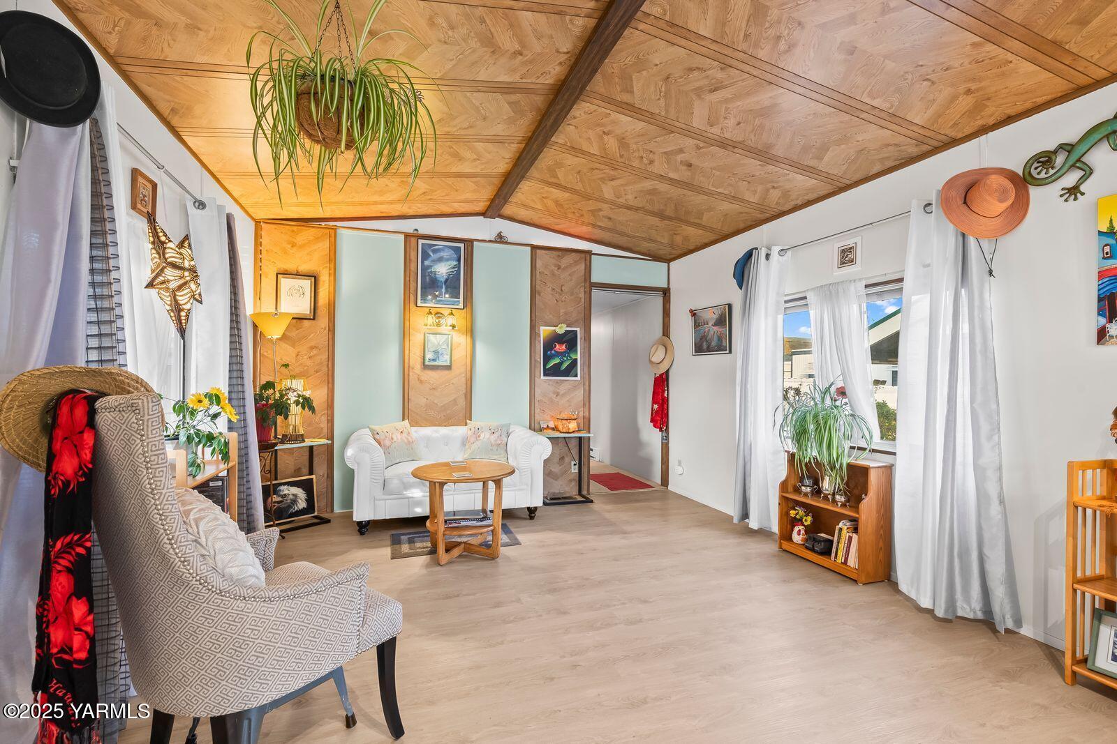 3601 Castlevale Road, Unit 14 Yakima, WA 98902 - Photo 5 of 24 a living room with furniture and a floor to ceiling window