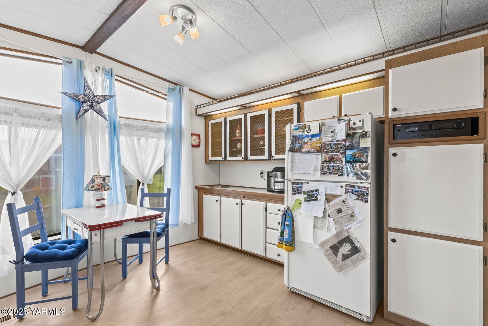 3601 Castlevale Road, Unit 14 Yakima, WA 98902 - Photo 10 of 24 a kitchen with stainless steel appliances kitchen island granite countertop a refrigerator and a stove