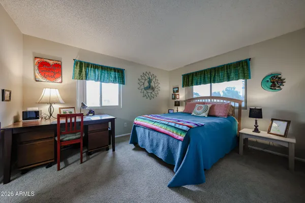 a bed room with furniture and a window