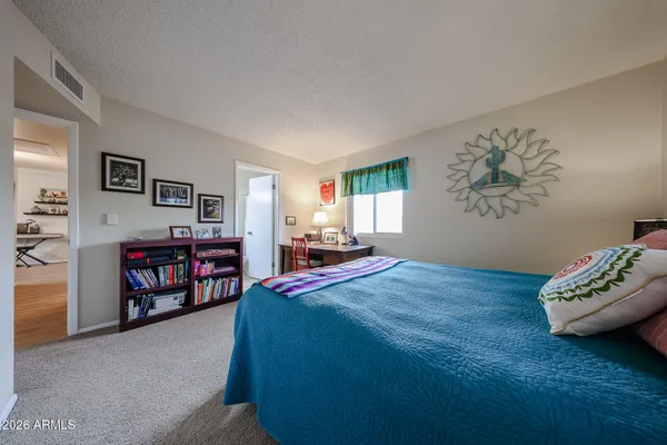 a bedroom with a bed and a closet