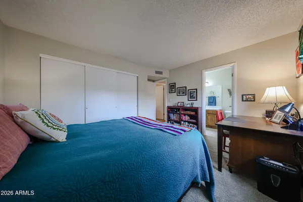 a room with a bed and window