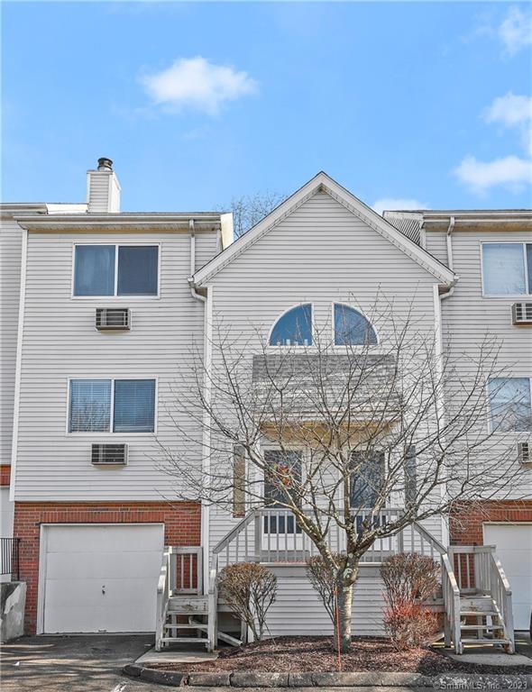 925 Oronoke Road, Unit 36K Waterbury, CT 06708 - Photo 1 of 1 a view of a building with many windows