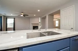 a view of kitchen with sink and microwave