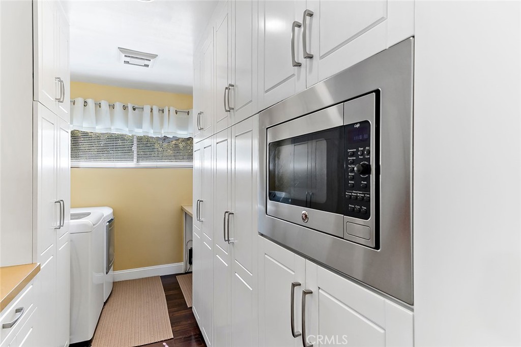 2818 Ostrom Avenue Long Beach, CA 90815 - Photo 17 of 41 a view of a hallway with washer and dryer