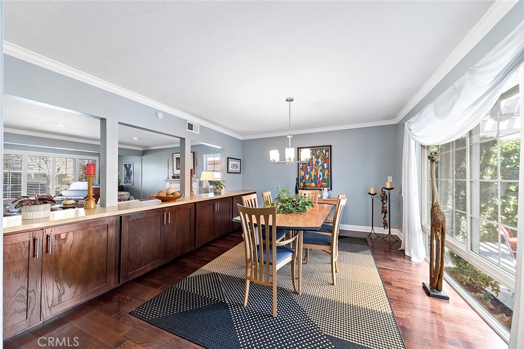 2818 Ostrom Avenue Long Beach, CA 90815 - Photo 19 of 41 a view of a dining room with furniture window and wooden floor