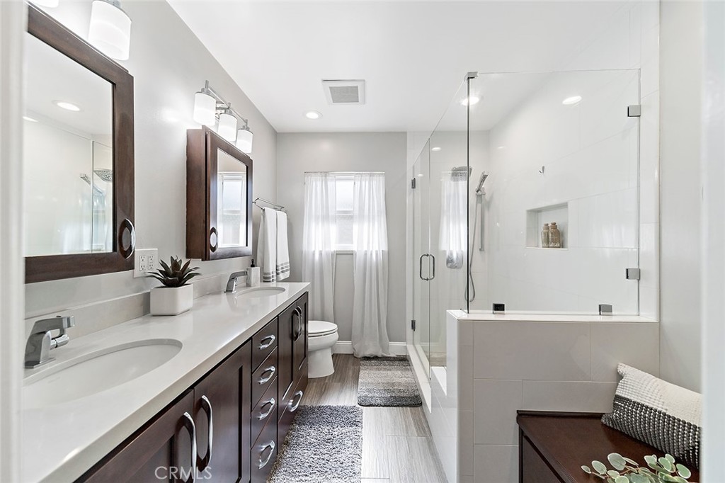 2818 Ostrom Avenue Long Beach, CA 90815 - Photo 28 of 41 a bathroom with a tub sink and mirror