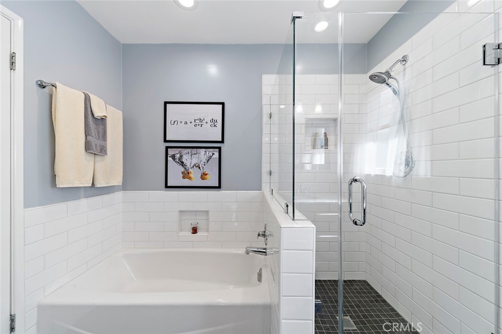 2818 Ostrom Avenue Long Beach, CA 90815 - Photo 30 of 41 a bathroom with a bathtub and a shower