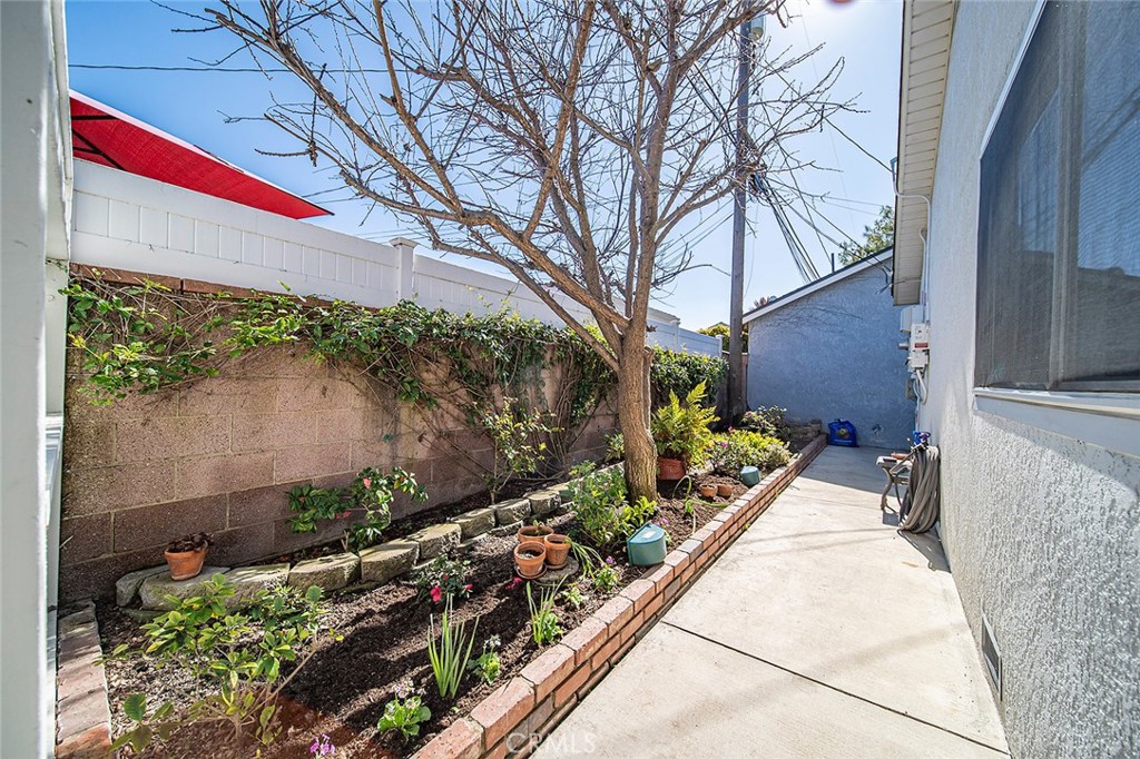 2818 Ostrom Avenue Long Beach, CA 90815 - Photo 38 of 41 a house with trees in front of it