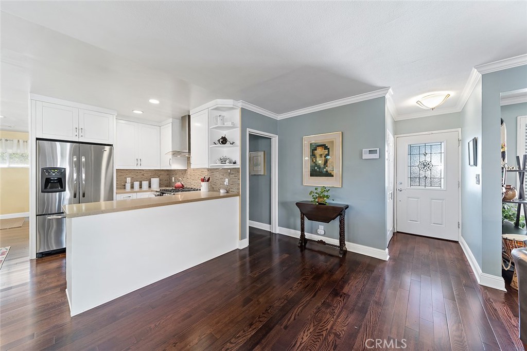 2818 Ostrom Avenue Long Beach, CA 90815 - Photo 7 of 41 a kitchen with a refrigerator and a stove top oven