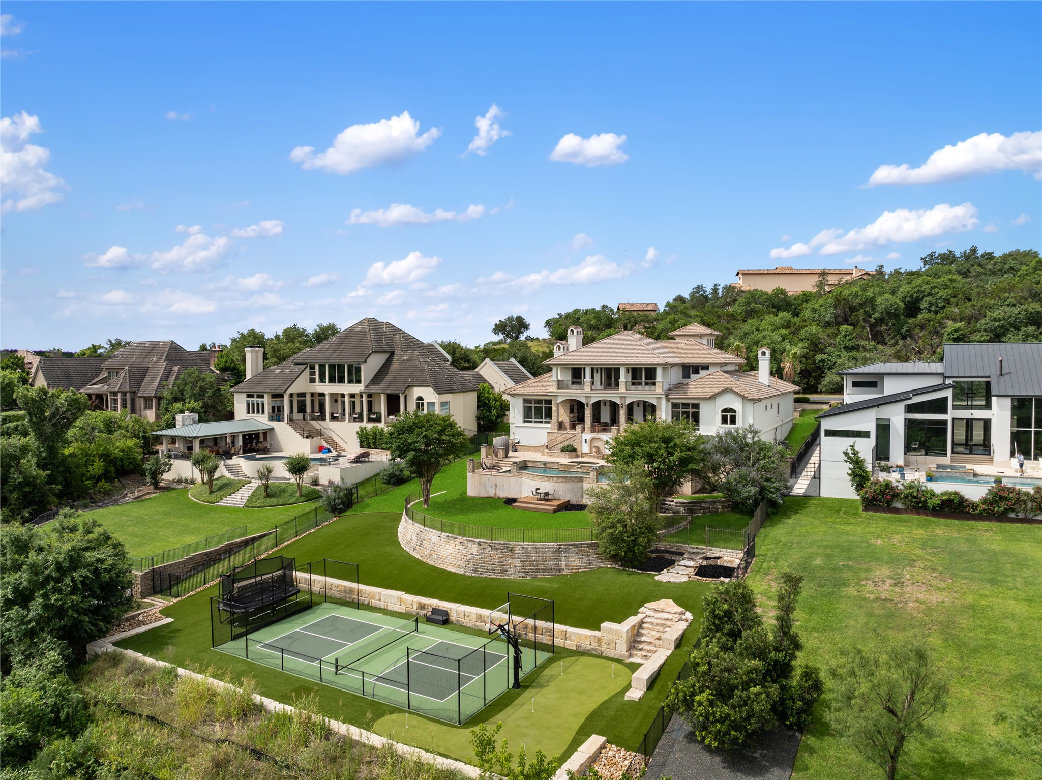 Aerial perspective of suburban area featuring a pool