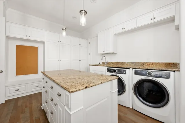 a view of kitchen sink and washer dryer