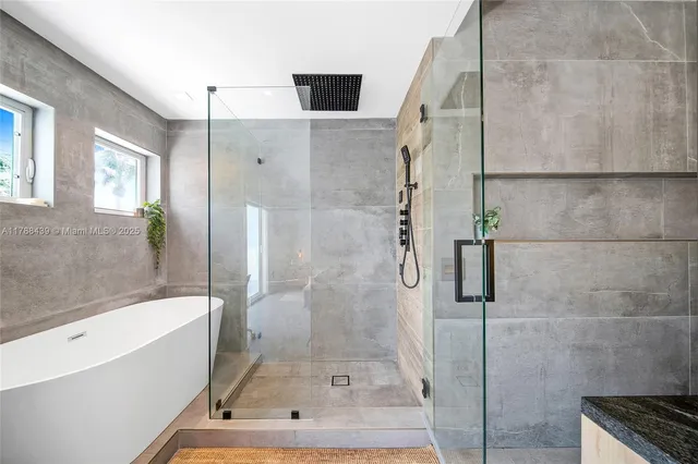 a living room with baby lots of books and a large tree