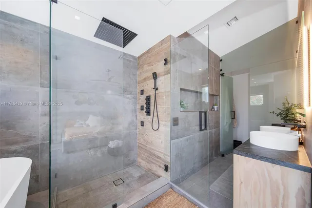 a living room with furniture and a floor to ceiling window