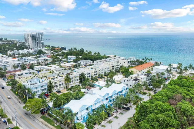 a front view of building with yard