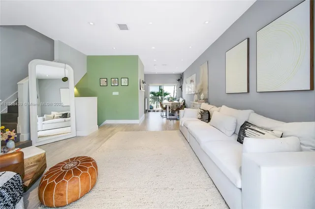 a kitchen with a refrigerator and a sink