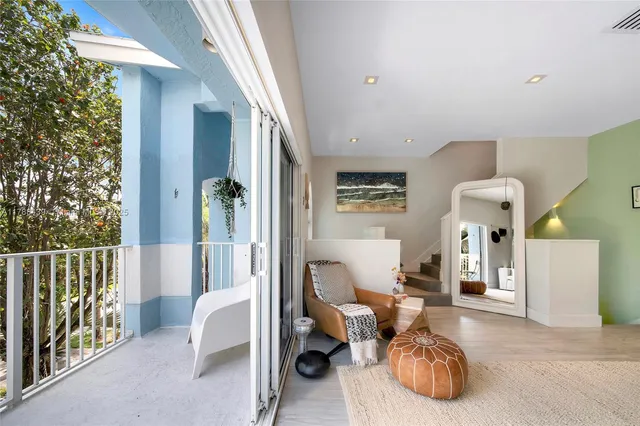 a view of a balcony with lake view and a potted plant