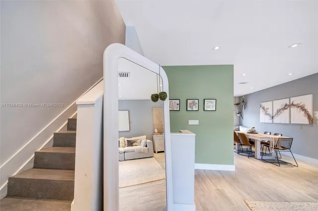 a view of a livingroom with furniture and a flat screen tv