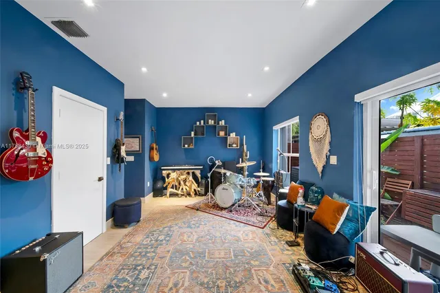 a view of a backyard with sitting area