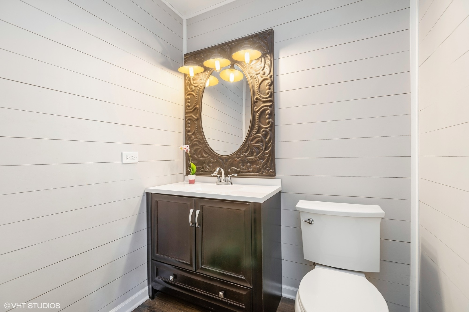 13N368 High Chapparal Elgin, IL 60124 - Photo 19 of 31 a bathroom with a toilet a sink and mirror