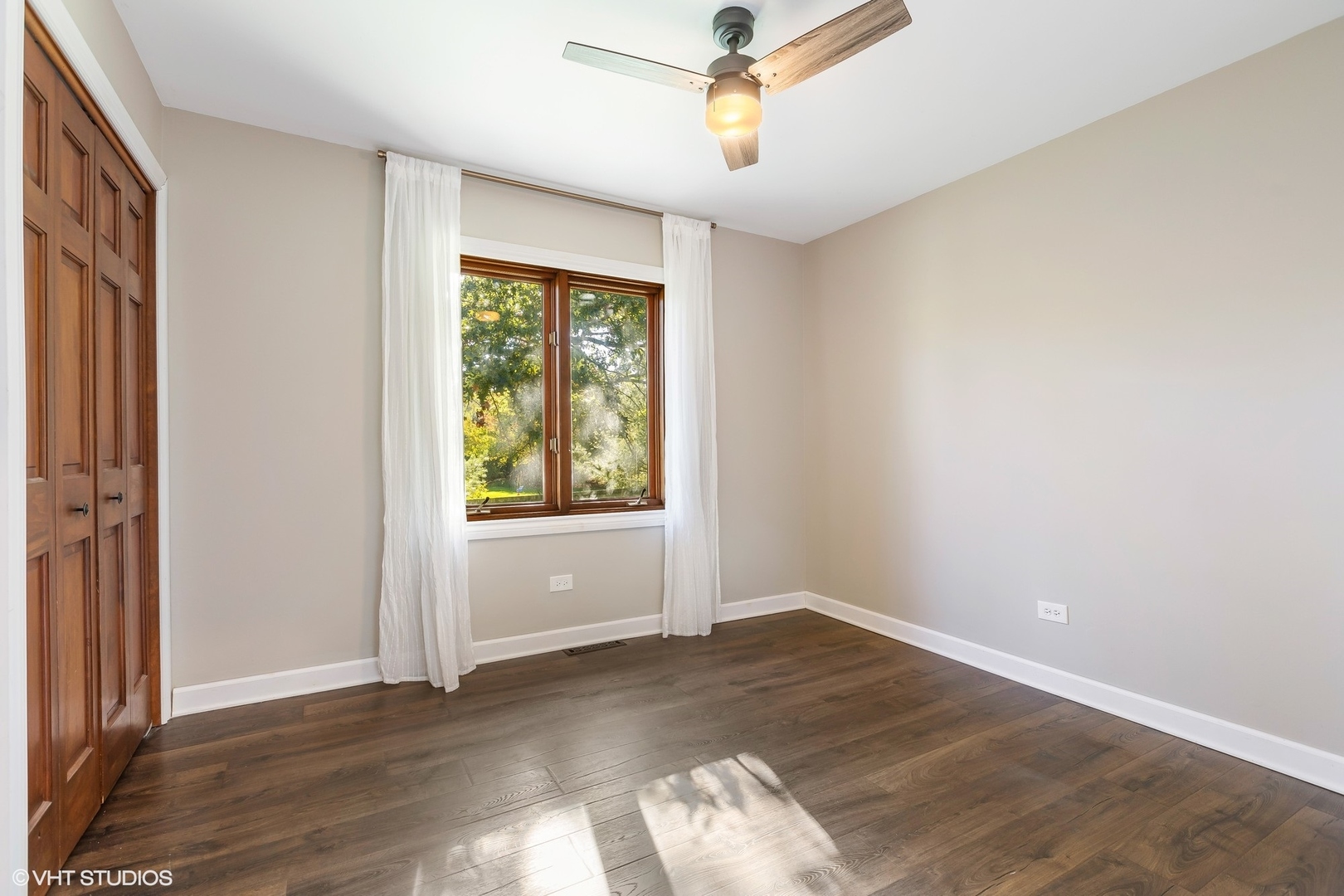 13N368 High Chapparal Elgin, IL 60124 - Photo 24 of 31 a view of empty room with wooden floor and fan