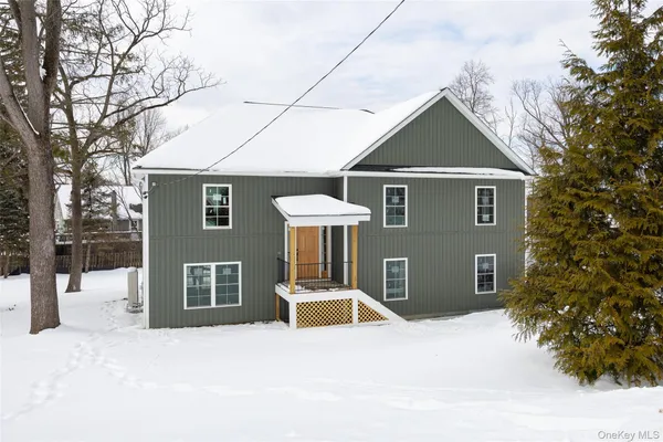 a front view of a house with yard