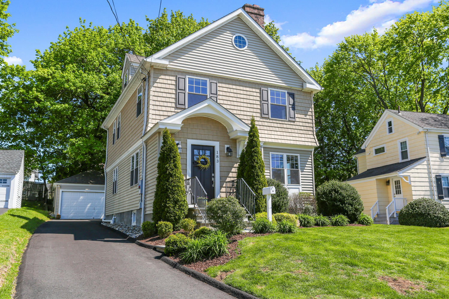 a front view of a house with a yard